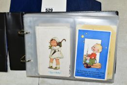 POSTCARDS, one album containing 129 early 20th century Postcards on a Children's theme featuring