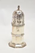AN EARLY 20TH CENTURY SILVER SUGAR CASTER, polished hexagonal form, openwork cover, on a stepped