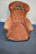 A VICTORIAN WALNUT SPOON BACK ARMCHAIR, on turned front legs, and casters (condition:-distressed