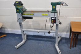 A RECORD DML320 WOODTURNING LATHE ON STAND with variable speed control and reverse function, total