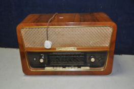 A ROCHLITZ TURVEL 2 VALVE RADIO in a Walnut cabinet (PAT fail due to uninsulated plug) powers up but