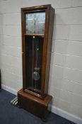 AN ART DECO FRENCH WALNUT CHIMING LONGCASE CLOCK, with a silvered dial, signed Vedette, height