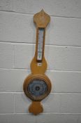 AN OAK BAROMETER, the face labelled Daymaster, width 27cm x height 95cm (condition - overall good