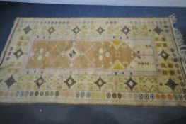 A TURKISH MILAS RUG, 220cm x 122cm (dirty and discoloured) a late 20th century woollen rug 126cm x