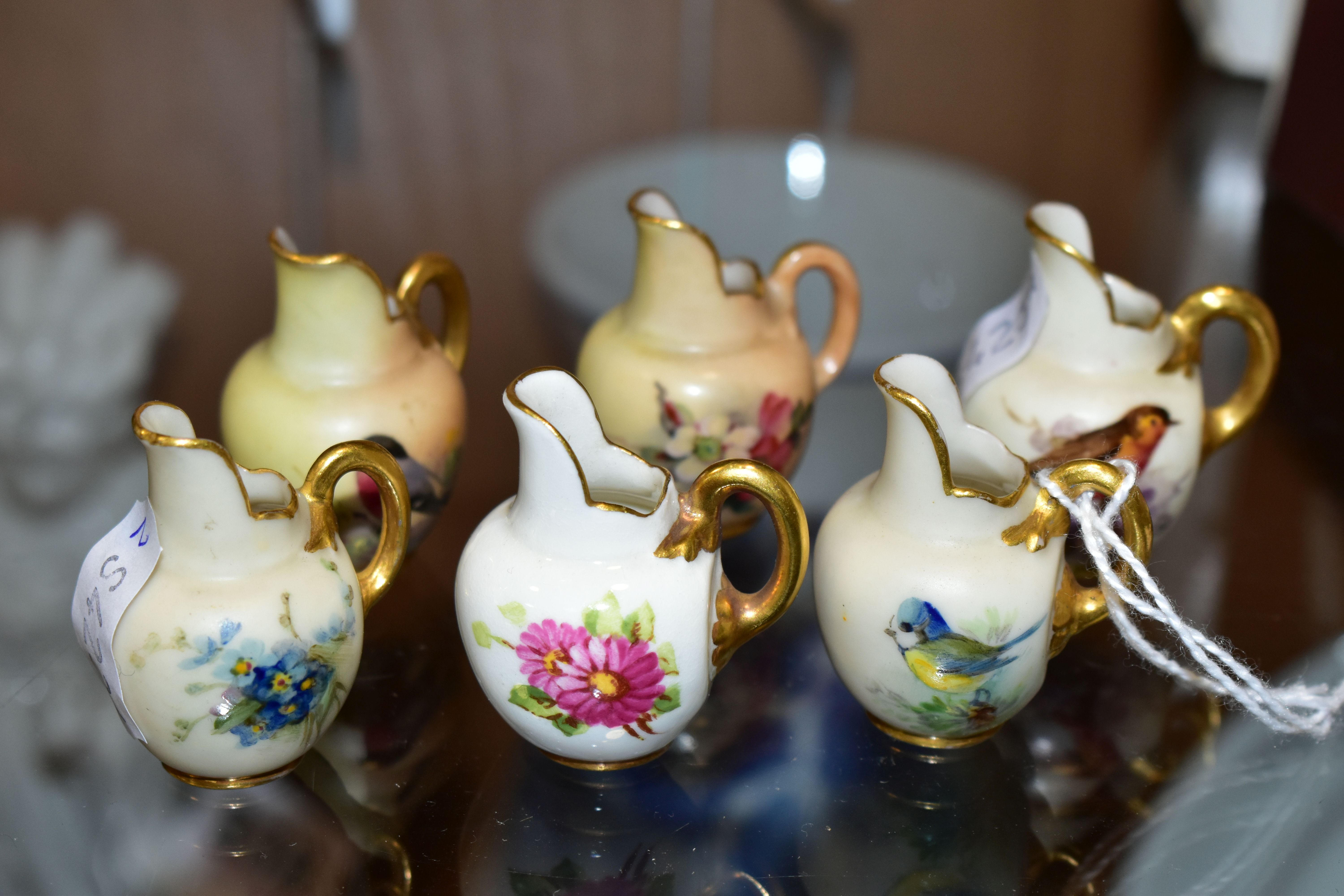 SIX ROYAL WORCESTER MINIATURE JUGS, three painted with British Birds - Bull Finch, Blue Tit and
