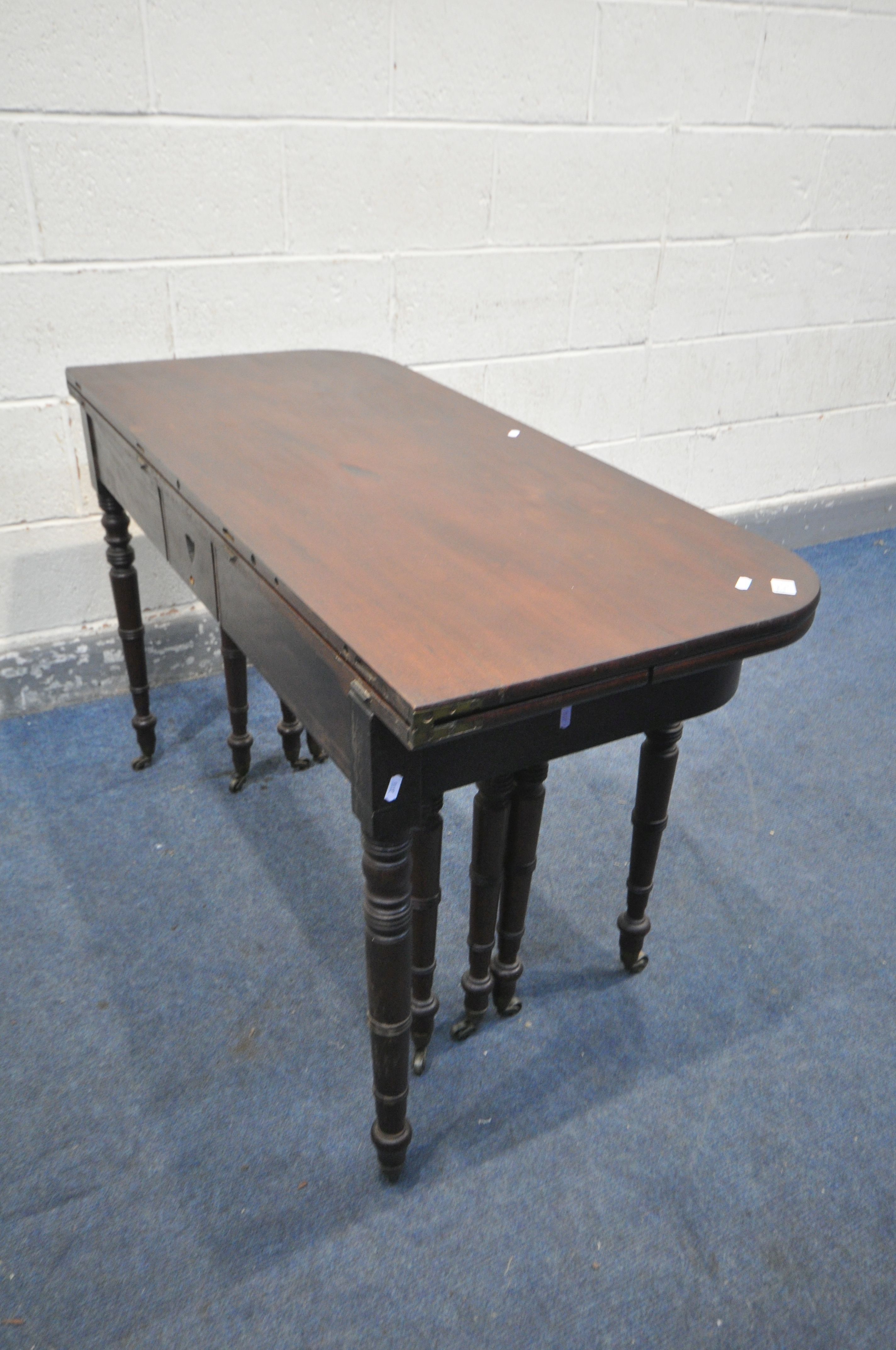 A REGENCY MAHOGANY CONCERTINA ACTION EXTENDING DINING TABLE, with two sized additional leaves, on - Image 9 of 11