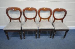 A SET OF FOUR VICTORIAN MAHOGANY BALLOON BACK CHAIRS, with grey upholstered seat pads, on turned and