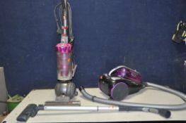 A DYSON DC40 UPRIGHT VACUUM CLEANER and a Hoover Rush Pets vacuum cleaner (both PAT pass and