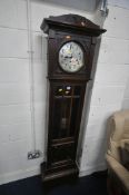 AN EARLY 20TH CENTURY OAK CHIMING LONGCASE CLOCK, with a brass and silvered dial, on a glazed trunk,