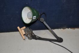 A VINTAGE ARTICULATED WORKSHOP LAMP with green and white painted shade (PAT pass and working)