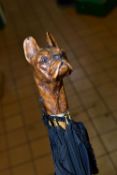 AN EDWARDIAN UMBRELLA WITH CARVED WOODEN HANDLE IN THE FORM OF A FRENCH BULLDOG, by Thomas Briggs