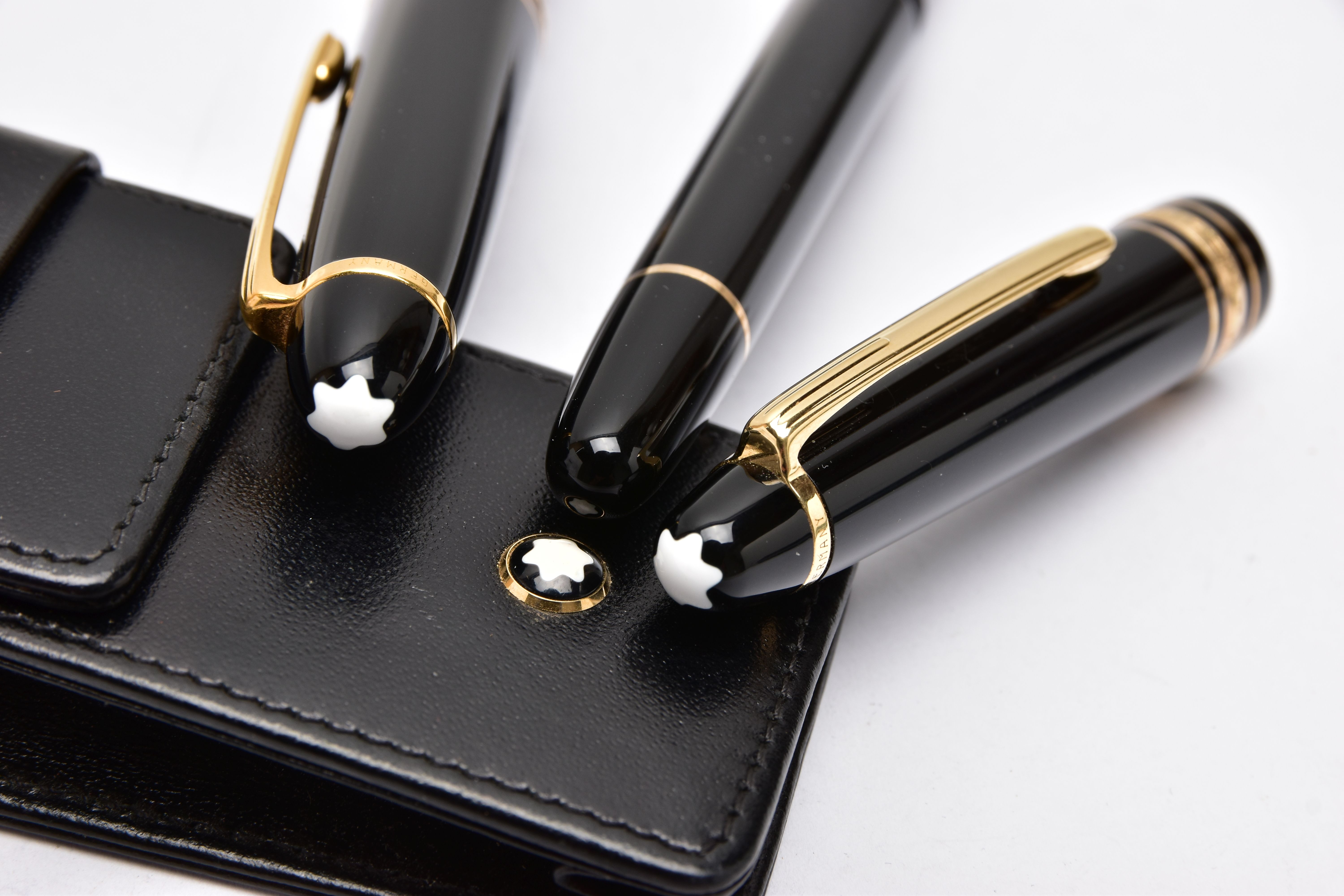 A TWO PIECE 'MONTBLANC' PEN SET, to include a black laquaer with gold detailed coller, fountain pen, - Image 4 of 4