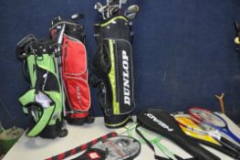 THREE JUNIOR GOLF BAGS containing various clubs such as Nike, Wilson, Dunlop, J-Tek and Masters