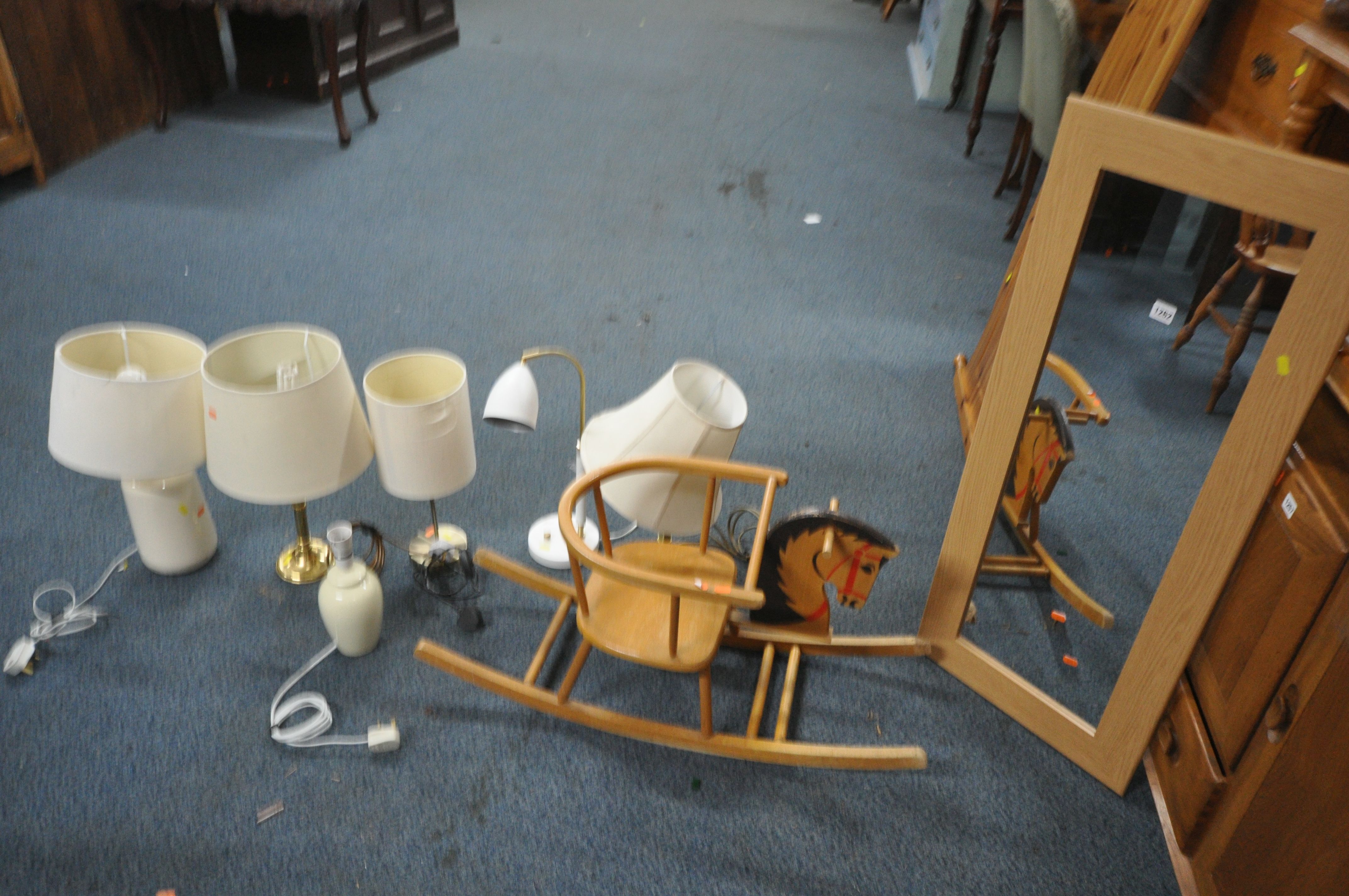 A DOLLS BOW ROCKING HORSE, along with six table lamps including two brass lamps, and a wall
