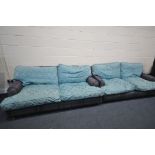 A PAIR OF HOWARD AND SONS STYLE SOFA, having tartan fabric and later blue cushions, on turned