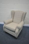A MODERN BEIGE UPHOLSTERED WING BACK ARMCHAIR, width 85cm x depth 85cm x height 100cm (condition:-