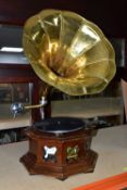 A REPRODUCTION GRAMOPHONE, with horn and wooden base, does wind and turntable revolves (1)