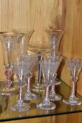 A COLLECTION OF 20TH CENTURY DRINKING GLASSES WITH COLOURED GLASS STEMS, comprising a set of five