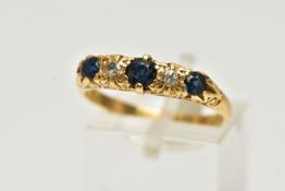 A YELLOW METAL SAPPHIRE AND DIAMOND RING, designed with three circular cut deep blue sapphires,