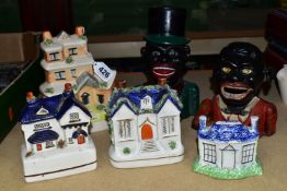 A COLLECTION OF MONEY BOXES, comprising four ceramic Staffordshire/Staffordshire-style money boxes