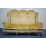 A GEORGIAN STYLE HIGH WING BACK SOFA, gold fabric, flat outswept arms, on four cabriole legs, length