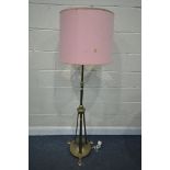 AN ARTS AND CRAFTS BRASS TELESCOPIC OIL LAMP, converted to a standard lamp, max height 179cm x min