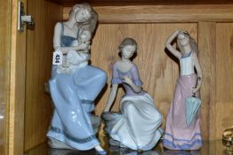 THREE NAO FIGURES, comprising My Little Girl no 1297, Spring Reflections no 1392, and Girl with