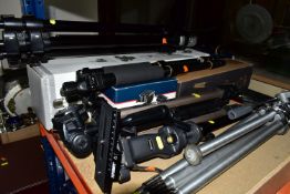 A GROUP OF TRIPODS, comprising a boxed Manfrotto 055PROB tripod with a boxed Manfrotto geared head