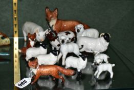 A GROUP OF BESWICK FARM ANIMALS AND FOXES, comprising a Fox - Standing model no 1016A (one leg and