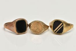 THREE SIGNET RINGS, to include a polished onyx inlay signet ring, collet set in a yellow metal mount