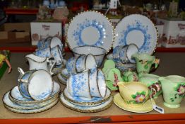 A ROYAL ALBERT CHINA TEA SET PATTERN 1382, a pale blue floral design on a white ground with gold