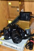 A BOXED D7100 DIGITAL SLR CAMERA with two batteries, charger, a boxed Nikkor AF-SDX 18-55mm f3.5