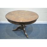 A GEORGIAN FLAME MAHOGANY CIRCULAR TRIPOD TABLE, on brass caps and casters, diameter 100cm x