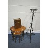 A BURR WALNUT NEST OF THREE TABLES, with Queen Anne legs, a wrought iron telescopic oil lamp