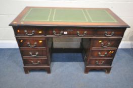 A REPRODUCTION MAHOGANY TWIN PEDESTAL DESK, with green and tooled leather writing surface, and