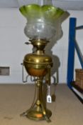 AN ARTS & CRAFTS BRASS AND COPPER OIL LAMP IN THE STYLE OF W.A.S. BENSON, the frilled green and
