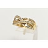 A YELLOW METAL RING, openwork crossover style ring set with colourless paste, stamped 585, ring size