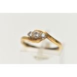 A DIAMOND THREE STONE RING, three single cut diamonds, prong set, yellow gold bypass mount,