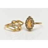 TWO RINGS, the first a 9ct gold cluster ring set with a marquise cut citrine in a surround of