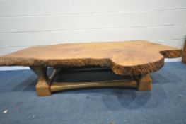 A LARGE LIVE EDGE YEWWOOD COFFEE TABLE, on a base with a shaped upright and stretchers, length 184cm