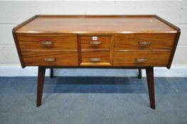 A MID CENTURY TEAK SIDEBOARD, with six sized drawers, on splayed and tapered legs, width 114cm x