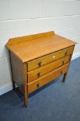 AN EARLY 20TH CENTURY OAK CHEST OF THREE LONG DRAWERS, width 91cm x depth 44cm x height 87cm (