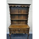 A REPRODUCTION GEORGIAN STYLE OAK DRESSER, the top with two shelves, on a base with two drawers, and