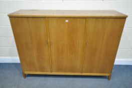 A MID CENTURY CARLSSON & REICKE SIDEBOARD, the three doors enclosing a beech interior with three