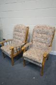 A PAIR OF BEECH FRAMED ARMCHAIRS, with loose floral cushions