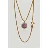 A 9CT GOLD RUBY AND DIAMOND PENDANT, seven circular cut rubies, prong set with a surround of round