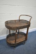 A MID CENTURY RATTAN AND BAMBOO TWO TIER TROLLEY, length 68cm x depth 45cm x height 86cm (