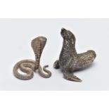 TWO WHITE METAL FIGURINES, the first a white metal python snake, decorated with a textured detail,