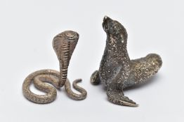 TWO WHITE METAL FIGURINES, the first a white metal python snake, decorated with a textured detail,