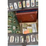 CIGARETTE CARDS, in seven albums and loose, complete sets, part sets and some higher value 'odds'